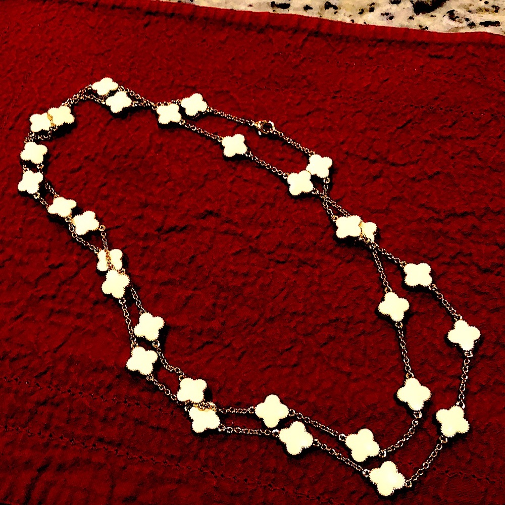 Beautiful gold tone, and cream colored necklace